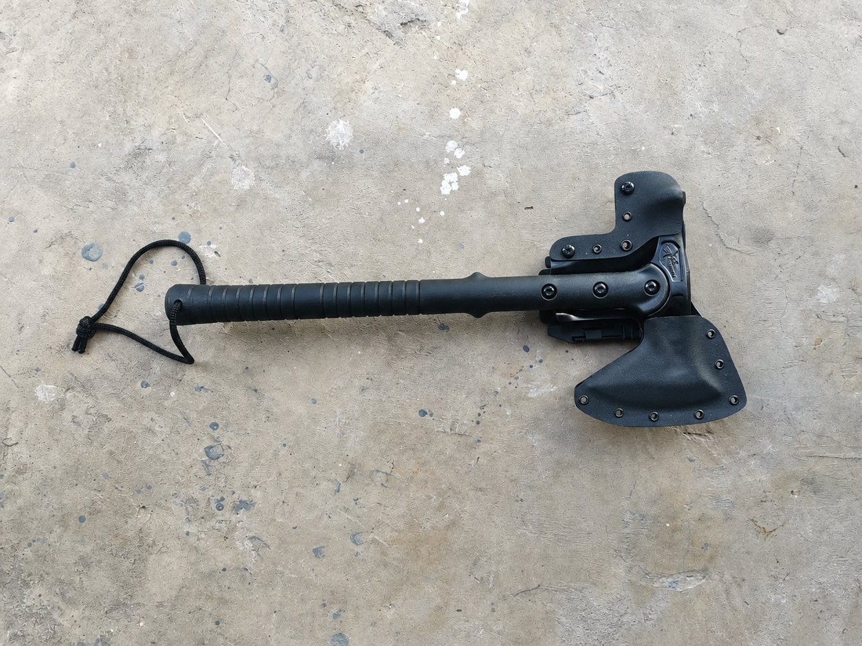 Custom black Kydex carry system fitted to an axe